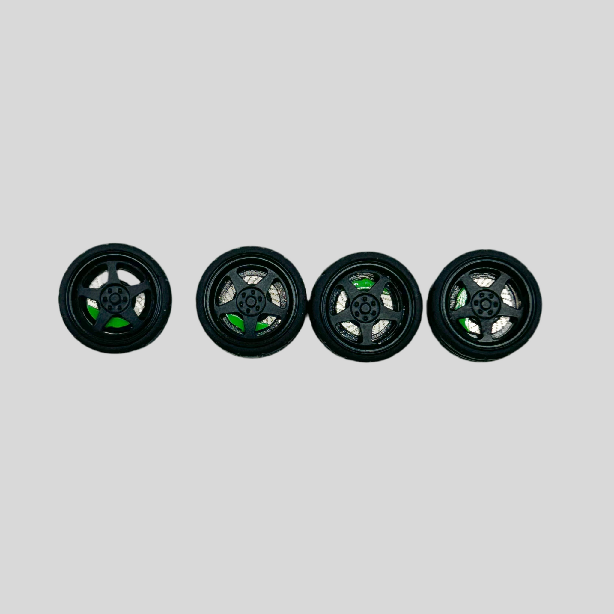 NEW- 10mm 5 Spoke “Alien” Black and Green Alloy Bearing Wheels. (Spinner)